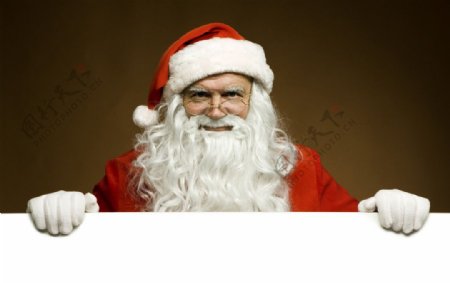 空白广告牌后的圣诞老人图片