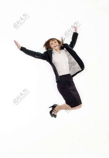 高兴跳跃的商务美女图片