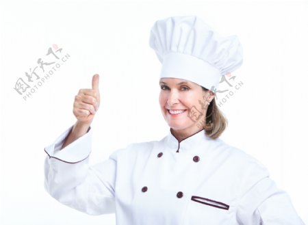 伸出大拇指的女厨师图片